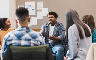 The group of students meet to discuss life experiences.