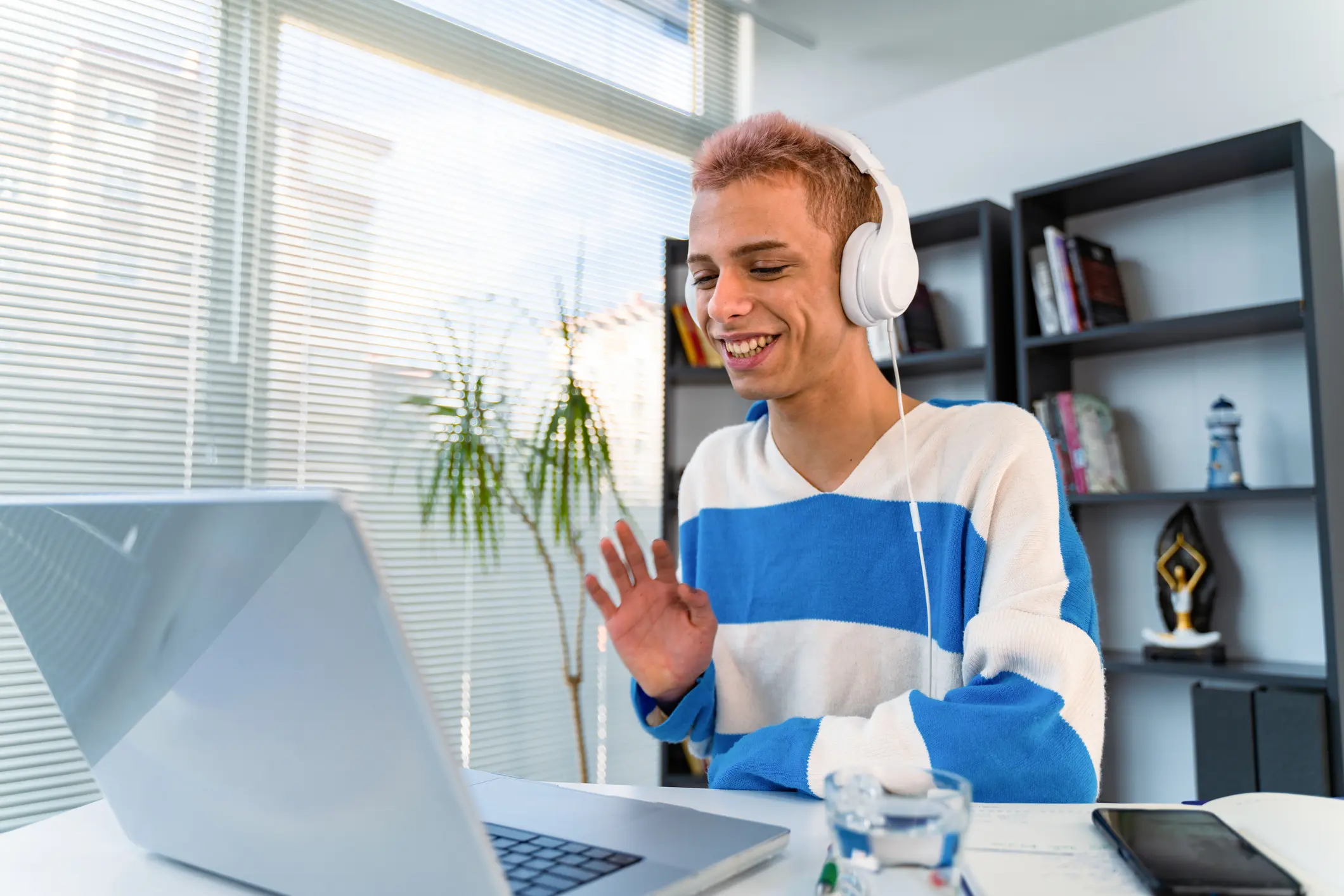 Transgender person using laptop working from home